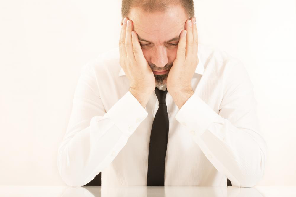 Picture showing a man stressed about basics of bookkeeping and accounting